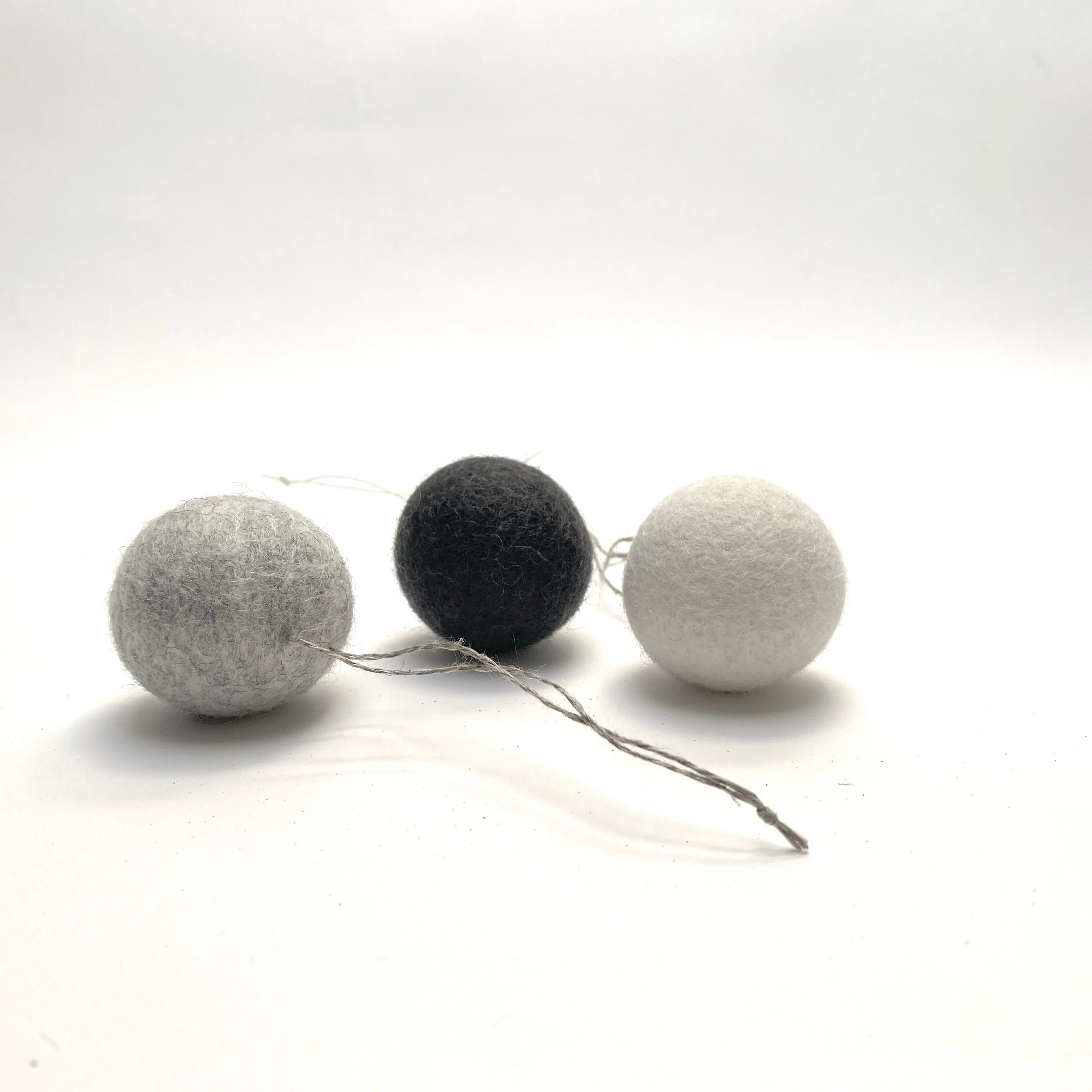 felted wool balls (in cotton bag)