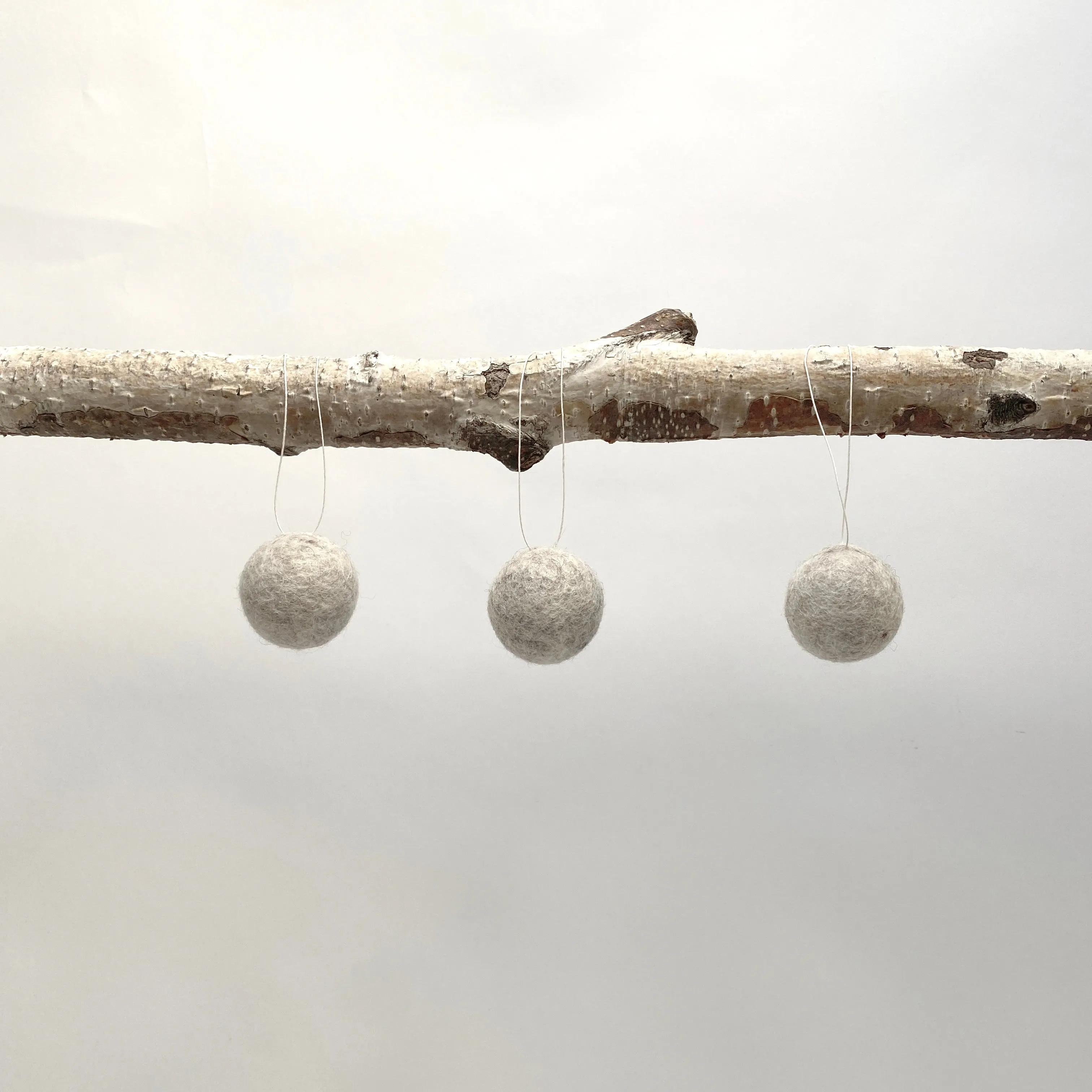 felted wool balls (in cotton bag)