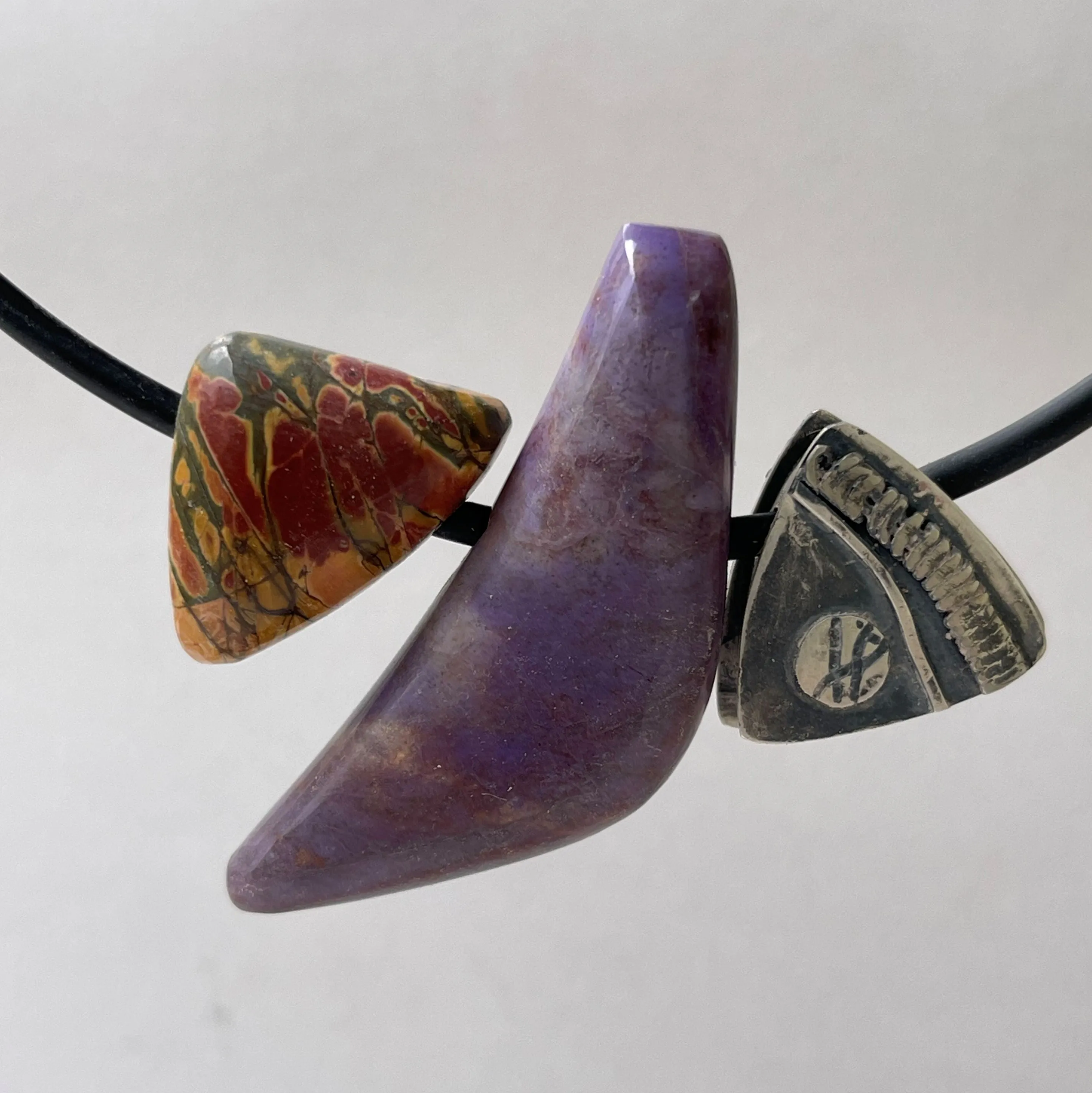 ustome Cut Dinasaur Bone, Petrified Wood, Turkish Purple Jade, Cherry Creek Jasper  and hand made sterling silver bead Pendant